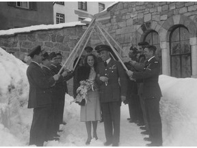 Members of the RCAF Flyers hockey team, 1948 Olympic gold medallists, form an honour guard at the wedding of Bea and Hubert Brooks on Feb. 9, 1948.