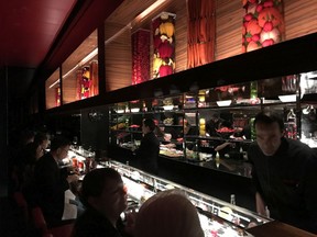 Diners at L'Atelier de Joël Robuchon in Montreal