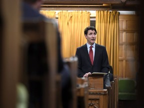 Prime Minister Justin Trudeau looks towards the gallery, where the family of Colten Boushie watch as he delivers a speech on the recognition and implementation of Indigenous rights in in the House of Commons on Parliament Hill in Ottawa on Wednesday, Feb. 14, 2018.