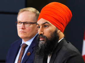 NDP finance critic Peter Julian and NDP leader Jagmeet Singh unveil the NDP's top priorities ahead of the federal budget, Tuesday, Feb. 13, 2018.