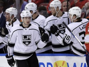 Nick Shore (21) is congratulated after scoring a goal against the Panthers during the second period of the Kings' game in Florida on Feb. 9.