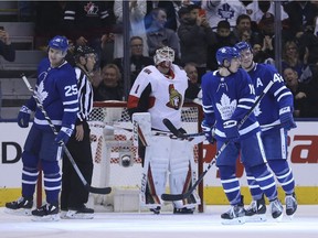 Senators netminder Mike Condon looks skyward after the Maple Leafs' James van Riemsdyk (25) tips in a shot for a second-period goal. Jack Boland/Postmedia