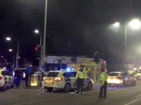 In this image taken from video made available by Gem News, police attend the scene of an incident in Leicester, central England, Sunday Feb. 25, 2018. Police for the English city of Leicester say they are responding to a "major incident" after receiving reports of an explosion and that emergency services were dealing with the incident on Hinckley Road and asked the public to stay away from the area. (Gem News via AP)