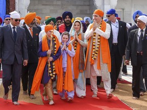 Prime Minister Justin Trudeau walks with his family during their visit to Golden Temple in Amritsar, India, Feb. 21, 2018.
