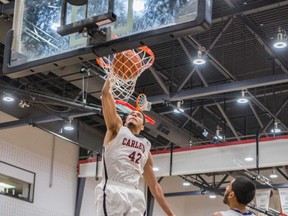 Eddie Ekiyor dominated the blocks as the Carleton men's Ravens qualified Wednesday for their 15th appearance in the last 16 Wilson Cup title bouts. (Valerie Wutti/Photo)