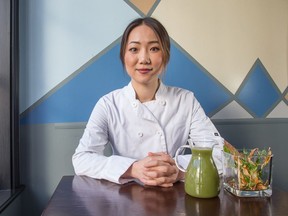 Chef Brianna Kim of Cafe My House on Wellington St with sunchoke watercress soup course. Photo by Wayne Cuddington/ Postmedia