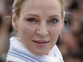 FILE - In this May 18, 2017 file photo, actress Uma Thurman poses for photographers during the photo call for the Un Certain Regard jury at the 70th international film festival, Cannes, southern France. Thurman has accused embattled Hollywood producer Harvey Weinstein of forcing himself upon her sexually and director Quentin Tarantino of making her perform a dangerous car stunt that injured her. Thurman is quoted in The New York Times on Saturday, Feb. 3, 2018, as saying Weinstein attacked her in London. She says he pushed her down and tried to shove himself on her and expose himself.