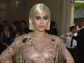 FILE - In this May 1, 2017 file photo, Kylie Jenner attends The Metropolitan Museum of Art's Costume Institute benefit gala celebrating the opening of the Rei Kawakubo/Comme des Garçons: Art of the In-Between exhibition in New York. In an Instagram post Sunday, Feb. 4, Jenner announced the birth of her baby girl born Thursday. It's the first child for the 20-year-old reality television star and the 25-year-old rapper Travis Scott.