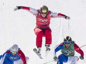 Canada's Dave Duncan races against Olympic athlete from Russia, Sergey Ridzik, Fraancois Place of France and JF Chapuis of France during quarterfinals of men's ski cross at Phoenix Snow Park during the Pyeongchang 2018 Winter Olympic Games in South Korea, Wednesday, Feb. 21, 2018.