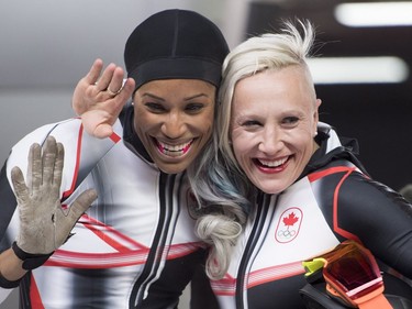 Canada's Kaillie Humphries and Phylicia George celebrate their bronze medal following women's bobsled at the Olympic sliding centre during the Pyeongchang 2018 Winter Olympic Games in South Korea, Wednesday, Feb. 21, 2018.