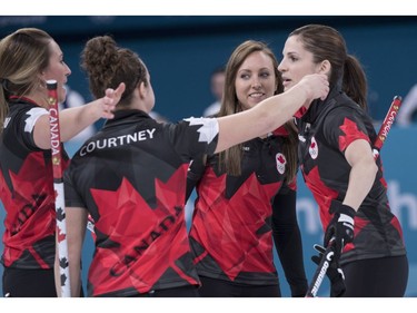 Canada's Emma Miskew, Joanne Courtney, skip Rachel Homan and Lisa Weagle, left to right, celebrate their victory over Switzerland in preliminary round in women's curling at the Pyeongchang 2018 Olympic Winter Games in Gangneung, South Korea, on Sunday, February 18, 2018.