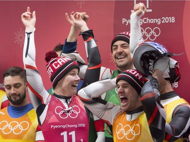 Canadian lugers Alex Gough, Sam Edney, Tristan Walker and Justin Snith celebrate their teams silver medal win during the team luge event at the Olympic Siding Centre during the Pyeongchang 2018 Winter Olympic Games in South Korea, Thursday, Feb. 15, 2018.