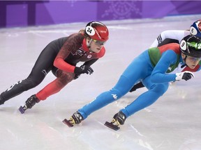 Canadian bronze medalist Kim Boutin, left, skates behind gold medalist Arianna Fontana, of Italy, in the women's 500-metre short-track speedskating final at the Pyeonchang Winter Olympics Tuesday, February 13, 2018 in Gangneung, South Korea.