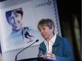 Nancy Greene reacts to her stamp that was unveiled by Canada Post who are celebrating Canadian Women in Winter Sports in Calgary, Wednesday, Jan. 24, 2018.