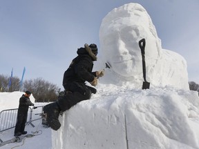 Artists carve some snow sculptures at the opening of the official launch of the 40th Winterlude in Gatineau Quebec Friday Feb 2, 2018.