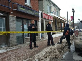 Police at a the scene of a robbery at 613 Medicinals cannabis dispensary on Montreal Road Saturday afternoon. A shot was fired during the robbery, but no one was struck. There were other reported injuries, however.