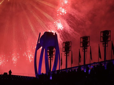 Fireworks explode over the extinguished Olympic cauldron during the closing ceremony of the 2018 Winter Olympics in Pyeongchang, South Korea, Sunday, Feb. 25, 2018.