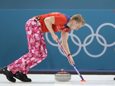 Norway's Haavard Vad Petersson sweeps a shot by a teammate during Wednesday's game.