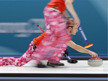 Norway's skip, Thomas Ulsrud, prepares to push the stone on one of his shots during Wednesday's game against Japan.