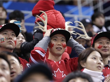 Fans watch during the second period of the preliminary round of the men's hockey game between South Korea and Canada at the 2018 Winter Olympics in Gangneung, South Korea, Sunday, Feb. 18, 2018.