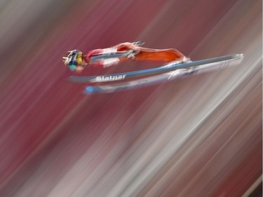 Tilen Bartol, of Slovenia, soars through the air during qualification for the men's large hill individual ski jumping competition at the 2018 Winter Olympics in Pyeongchang, South Korea, Friday, Feb. 16, 2018.