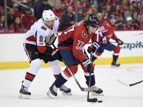 Senators winger Bobby Ryan tries to steal the puck from the Capitals' T.J. Oshie during a game on Nov. 22.