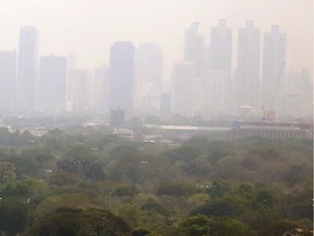 A thick smog hangs over downtown Bangkok, Thailand, early Thursday, Feb. 8, 2018. The Bangkok Real-time Air Quality Index shows unhealthy levels of PM2.5 (Particulates per Million) in the day. (AP Photo) ORG XMIT: XTZ103