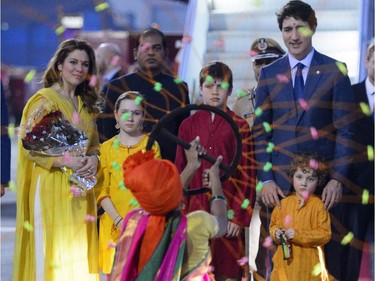 Performers welcome Prime Minister Justin Trudeau and wife Sophie Gregoire Trudeau, and children, Xavier, 10, Ella-Grace, 9, and Hadrien, 3, as they arrive in Mumbai, India on Monday, Feb. 19, 2018.