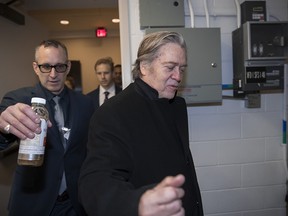 Steve Bannon, President Donald Trump's former chief strategist, takes a utility stairwell at the Capitol as he arrives for questioning by the House Intelligence Committee as part of its ongoing investigation into meddling in the U.S. elections by Russia, in Washington, Thursday, Feb. 15, 2018.