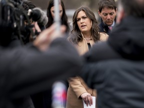 Sarah Huckabee Sanders, White House press secretary, center, speaks to members of the media outside the White House in Washington, D.C., U.S., on Wednesday, March 7, 2018.