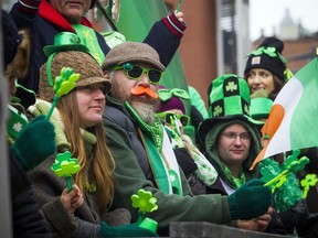 The 36th Annual St. Patrick's Day Parade took place Saturday March 10, 2018, to kick off the Ottawa Irish Festival. A crew decked out in their green filled the Moriarty's Property Maintenance and Landscaping float.  Ashley Fraser/Postmedia