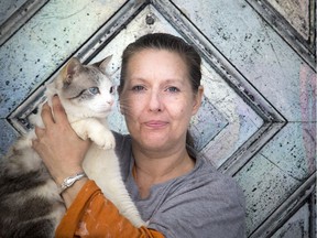 April Kibzey has been fostering cats in her home and trying to raise money to continue her efforts and awareness about adoption. Kibzey and her cats were photographed at her Vanier home Saturday March 10, 2018.