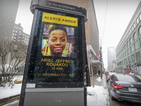 Electronic billboard on Mountain St. in Montreal displays amber alert for missing ten year old Ariel Jeffrey Kouakou Tuesday March 13, 2018.