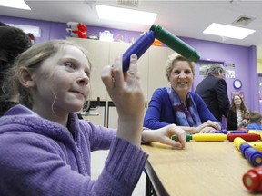 Ontario Premier Kathleen Wynne visits Olivia, 9, before an announcement at CHEO in Ottawa on Thursday, March 15, 2018.