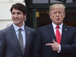 Prime Minister Justin Trudeau is greeted by U.S. President Donald Trump as he arrives at the White House in Washington, D.C., on October 11, 2017.