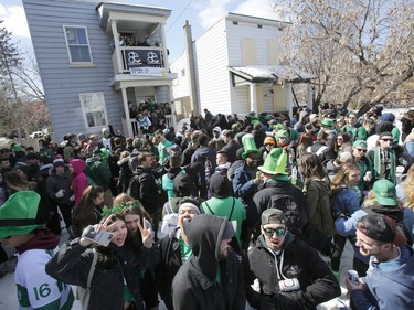Revellers take part in a St. Patrick's Day party on Russell Avenue in the Sandy Hill Neigbourhood of Ottawa on Saturday, March 17, 2018.