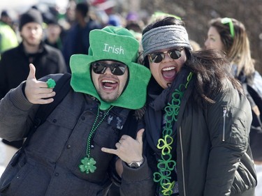 Brendan Mikan and Chelsea Wong take part in a St. Patrick's Day party on Russell Avenue in the Sandy Hill Neigbourhood of Ottawa on Saturday, March 17, 2018.