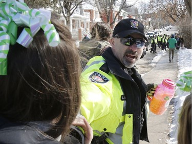 Police were on hand to monitor festivities at a St. Patrick's Day party on Russell Avenue in the Sandy Hill Neigbourhood of Ottawa on Saturday, March 17, 2018. Police confiscated alcohol from some of those on hand.