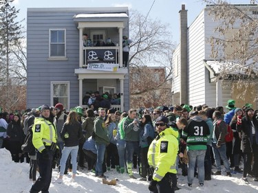 Police watch over a St. Patrick's Day party on Russell Avenue in the Sandy Hill Neigbourhood of Ottawa on Saturday, March 17, 2018.