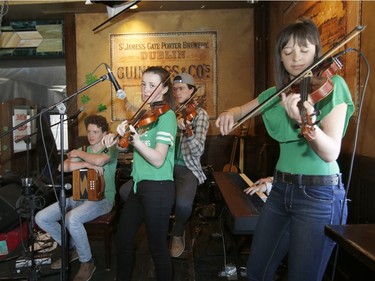 Mariel, left, and Jacquelin Enright of the Enright Family perform at D'Arcy McGee's in Kanata on St. Patrick's Day, Saturday, March 17, 2018.