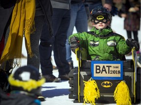 The annual cardboard sled derby took place Sunday March 25, 2018 at Camp Fortune. Competitors created their derby sleds with only cardboard, tape, string, garbage bags, glue and some added decorations to make the event colourful. Five-year-old Sam Wells was ready for another run as he was sitting, listens to the award ceremony.   Ashley Fraser/Postmedia