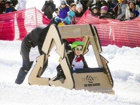 Competitors in the annual cardboard sled contest at Camp Fortune enjoyed the sunshine on Sunday. More sun is forecast for Monday, with clouds and showers rolling in later in the week.