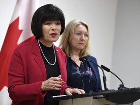 Minister of Health Ginette Petitpas Taylor speaks during an announcement on funding for the opioid crisis, as Liberal MP for Ottawa-Vanier Mona Fortier looks on, in Ottawa on Monday, March 26, 2018. The government is making it easier for patients to access prescription heroin and methadone in its fight against the opioid crisis.THE CANADIAN PRESS/Justin Tang ORG XMIT: JDT103