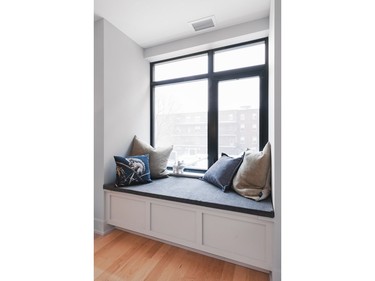 An inviting optional window seat in the master of unit 209 makes for a cosy reading spot.