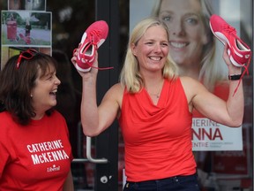 Catherine McKenna, then the federal Liberal candidate in Ottawa Centre, holds up a new pair of red sneakers as she launches her campaign in August, 2015.