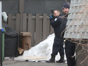 An identification unit at the scene of an investigation in Gatineau Friday.