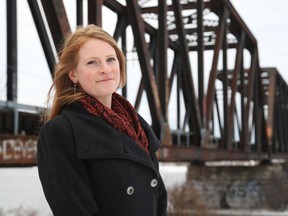 Aileen Duncan poses for a photo in front of the Prince of Wales Bridge on Tuesday. Jean Levac/Postmedia