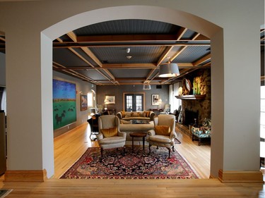 Off the foyer is a grand room, filled with art, heritage furniture and the original stone fireplace.