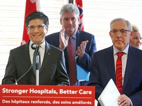 MPP Yasir Naqvi, left, MPP John Fraser and MPP Bob Chiarelli, right, announced planned funding for The Ottawa Hospital on Friday, March 23, 2018.