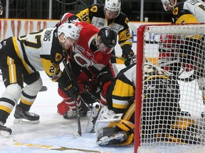 A scramble in front of Hamilton's net keeps Hamilton goalie Kaden Filcher busy, but resulted in no goal during playoff game 3 between the Ottawa 67s and the Hamilton Bulldogs Tuesday (March 27, 2018) at TD Place in Ottawa. Julie Oliver/Postmedia